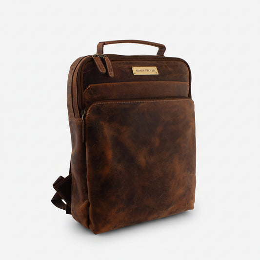 Brown leather backpack on a white background
